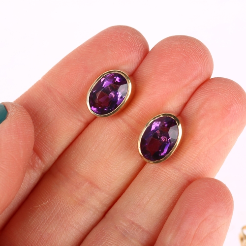 1293 - A pair of solitaire amethyst earrings, unmarked yellow metal rub-over settings with oval mixed-cut a... 