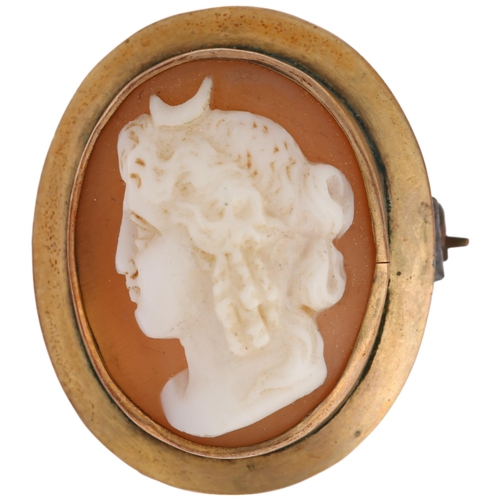 1294 - A 9ct gold shell cameo brooch, relief carved depicting Nyx Goddess of Night, 22.7mm, 3.1g