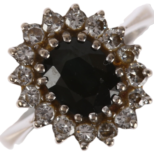 1298 - A late 20th century 18ct white gold sapphire and diamond oval cluster ring, London 1974, claw set wi... 