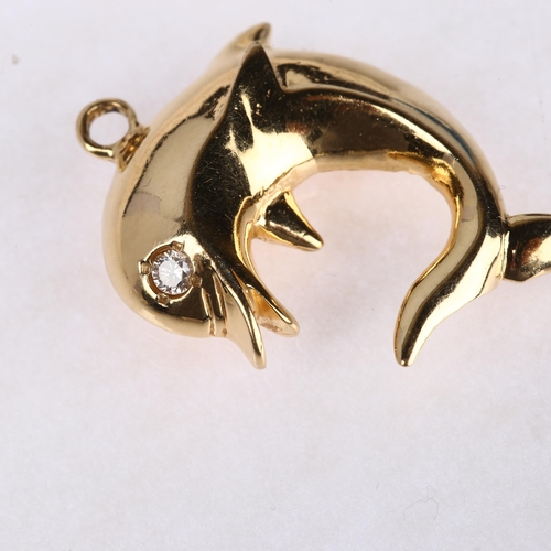 1300 - A 14ct gold diamond figural dolphin pendant, 33.7mm, 5.6g