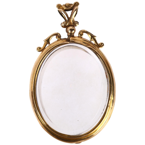 1301 - An early 20th century 9ct gold double-sided photo locket pendant, 52.2mm, 15.2g gross