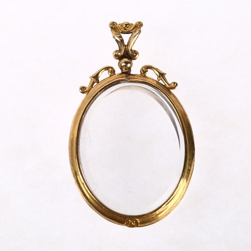 1301 - An early 20th century 9ct gold double-sided photo locket pendant, 52.2mm, 15.2g gross