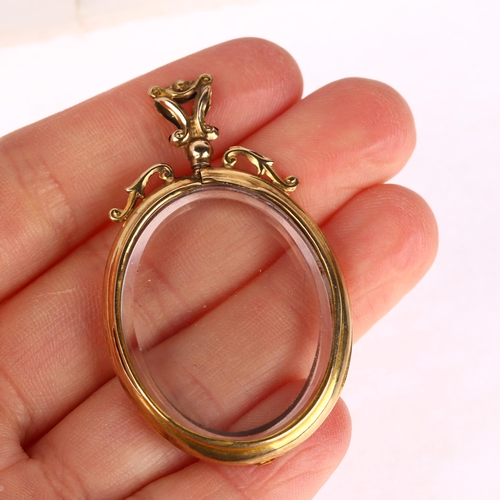 1301 - An early 20th century 9ct gold double-sided photo locket pendant, 52.2mm, 15.2g gross