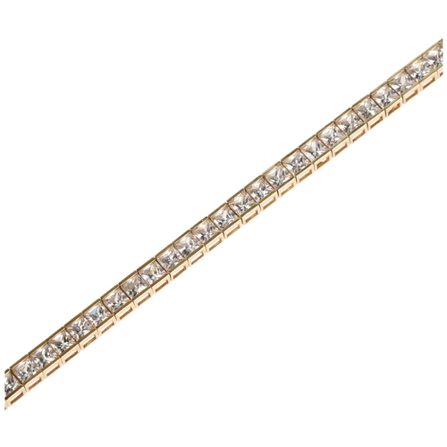 1302 - A 14ct gold cubic zirconia tennis line bracelet, 18cm, 10.2g gross