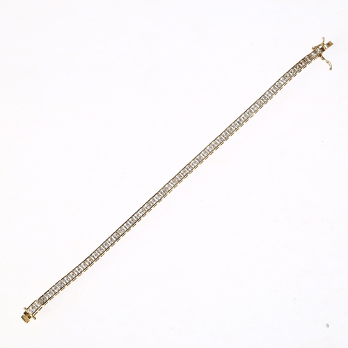 1302 - A 14ct gold cubic zirconia tennis line bracelet, 18cm, 10.2g gross