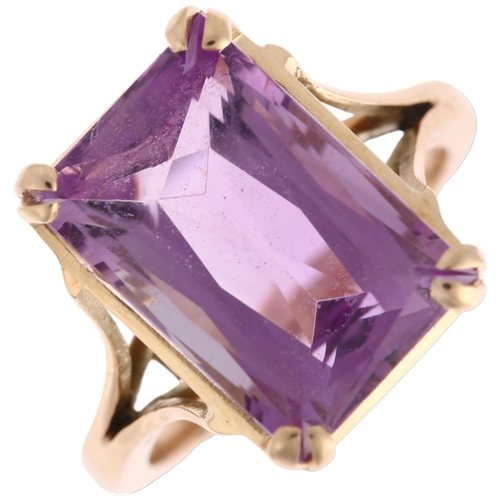 1306 - A late 20th century amethyst dress ring, unmarked rose gold settings with rectangular scissor-cut am... 