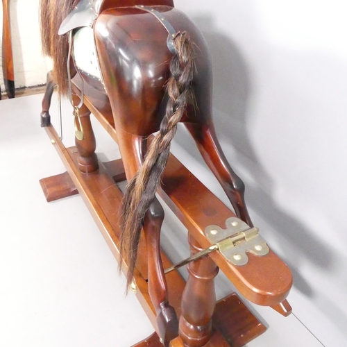 2000 - STEVENSON BROTHERS - A painted wooden rocking horse, 