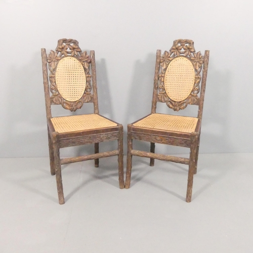 2013 - A pair of Black Forest naturalistically carved side chairs, the seats and backs recently re-caned.