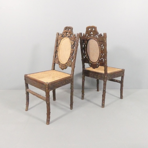 2013 - A pair of Black Forest naturalistically carved side chairs, the seats and backs recently re-caned.