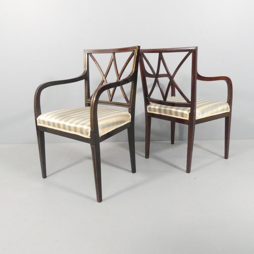 2021 - A pair of mid-century mahogany and brass line inlaid open arm or desk chairs.