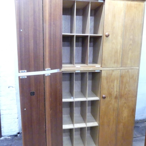 2025 - A mid-century oak record / vinyl cabinet, having four bi-fold doors and fitted interior. 102x203x46c... 