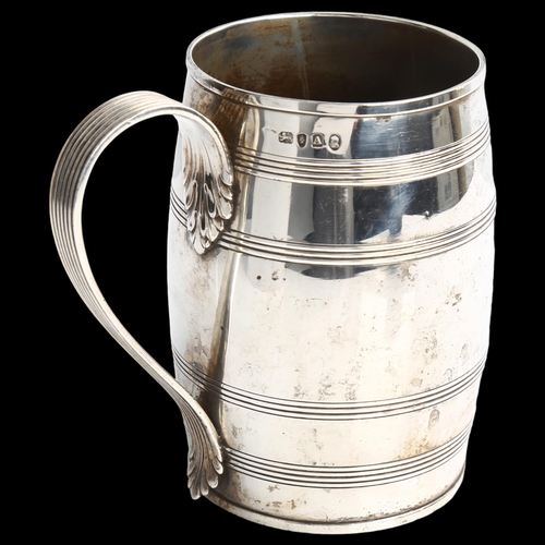 1775 - A George III silver barrel pint mug, with reeded decoration and acanthus leaf reeded handle, indisti... 