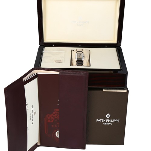 1068 - PATEK PHILIPPE - a lady's 18ct white gold diamond Twenty-4 quartz bracelet watch, ref. 4908/200G-011... 