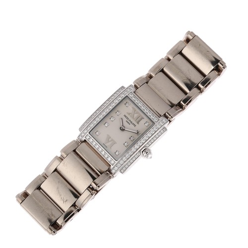 1068 - PATEK PHILIPPE - a lady's 18ct white gold diamond Twenty-4 quartz bracelet watch, ref. 4908/200G-011... 