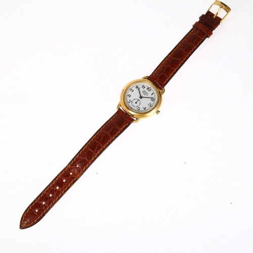 1077 - EMERICH MEERSON - a lady's gold plated stainless steel Officer's style quartz wristwatch, white dial... 