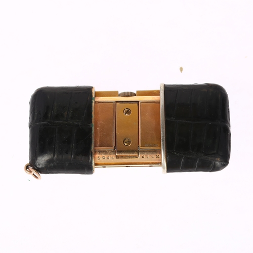 1083 - MOVADO - an Art Deco gold plated leather Ermeto chronometer travelling purse watch, circa 1930, squa... 