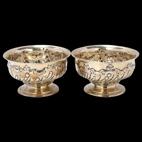 1688 - A pair of late Victorian silver pedestal bowls, James Deakin & Sons, Sheffield 1895, relief embossed... 