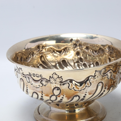 1688 - A pair of late Victorian silver pedestal bowls, James Deakin & Sons, Sheffield 1895, relief embossed... 