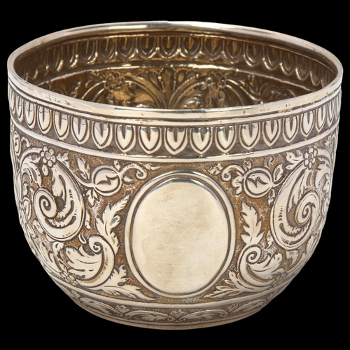 1690 - A Victorian silver sugar bowl, Charles Stuart Harris, London 1881, allover relief embossed foliate d... 