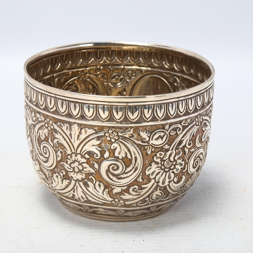 1690 - A Victorian silver sugar bowl, Charles Stuart Harris, London 1881, allover relief embossed foliate d... 