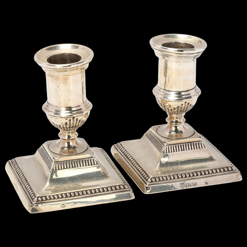 1694 - A pair of Edwardian silver squat table candlesticks, Harrison Brothers & Howson, Sheffield 1901, 9cm... 