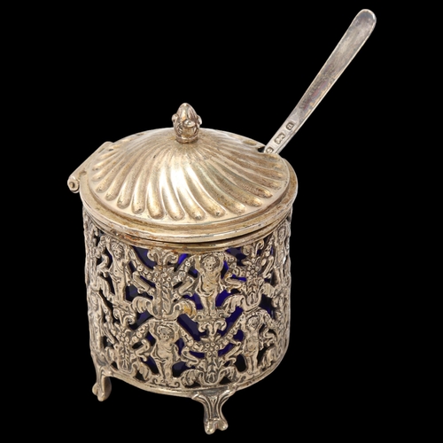 1699 - A Continental white metal mustard pot with blue glass liner, and English silver spoon, pot height 7.... 