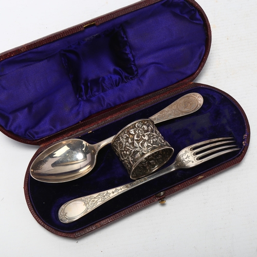 1711 - A Victorian cased silver travelling eating set, Martin Hall & Co, London 1876, with later napkin rin... 