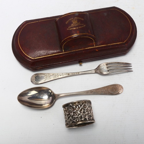 1711 - A Victorian cased silver travelling eating set, Martin Hall & Co, London 1876, with later napkin rin... 