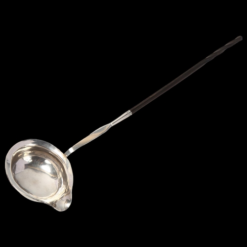 1726 - A Georgian silver whale bone toddy ladle, 34cm