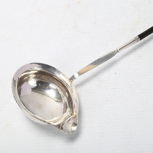 1726 - A Georgian silver whale bone toddy ladle, 34cm