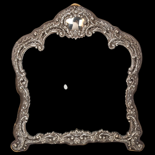 1747 - An Edwardian silver-fronted dressing table mirror, Henry Matthews, Birmingham 1903, relief embossed ... 