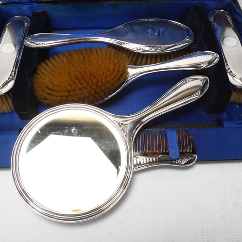 1756 - A cased Art Deco silver 6-piece travelling dressing table set, William Adams Ltd, mirror 28cm