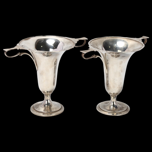 1759 - A pair of George V silver trophy cups, Walker & Hall, Sheffield 1913, 13cm, 9.2oz total