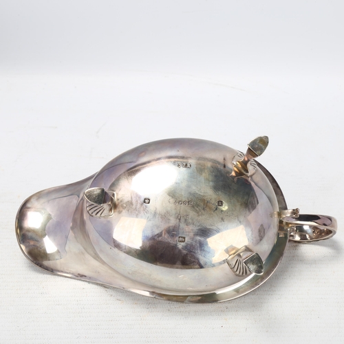 1766 - A George V silver sauce boat, Joseph Rodgers & Sons Ltd, Sheffield 1912, with beaded rim and a scrol... 