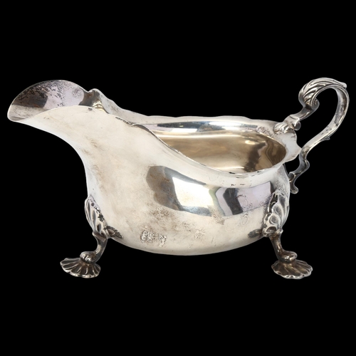 1768 - A George V silver sauce boat, Barker Brothers, Chester 1919, scalloped rim with scrolled acanthus le... 