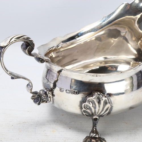 1768 - A George V silver sauce boat, Barker Brothers, Chester 1919, scalloped rim with scrolled acanthus le... 