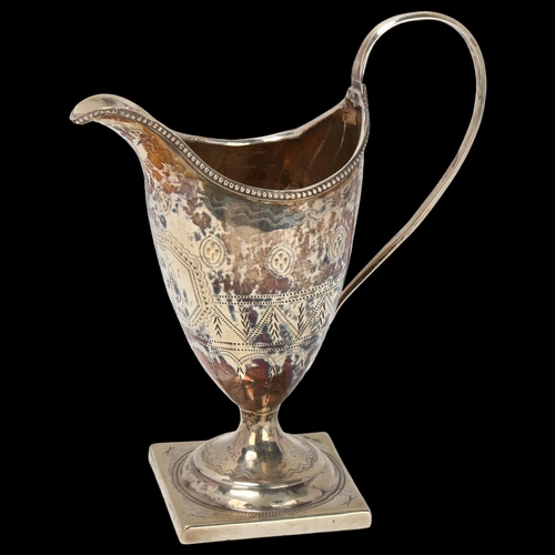 1769 - A George III silver helmet cream jug, John Merry, London 1792, bright-cut engraved decoration with b... 