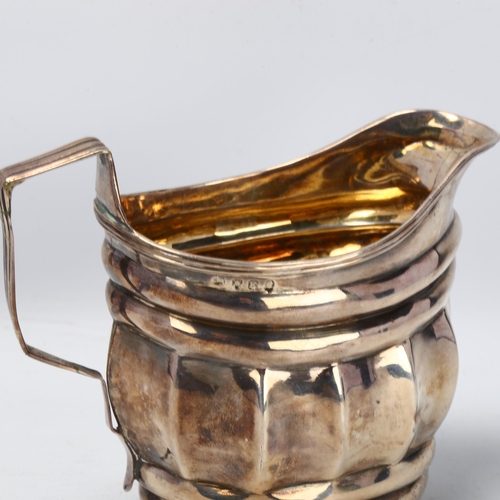 1771 - A George III silver cream jug, no maker, London 1805, waisted form, with reeded rim and gilt interio... 