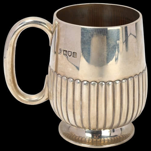 1777 - An Edwardian silver half pint christening mug, Charles Stuart Harris, London 1904, relief embossed h... 