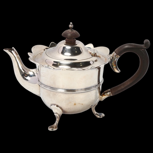 1781 - An Edwardian silver teapot, Walker & Hall, Chester 1906, circular form with shaped rim and turned wo... 