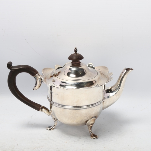 1781 - An Edwardian silver teapot, Walker & Hall, Chester 1906, circular form with shaped rim and turned wo... 