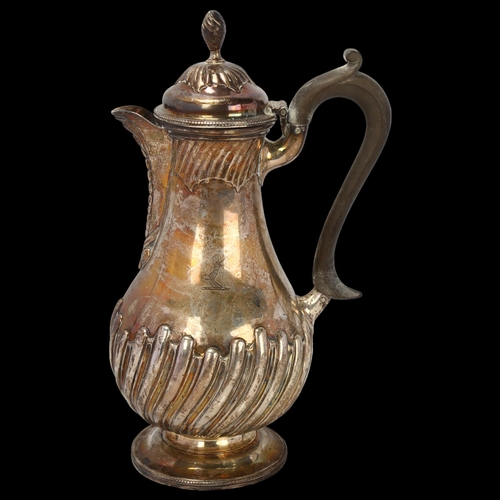 1784 - A Victorian silver hot water jug, Charles Stuart Harris, London 1891, baluster form, with half flute... 