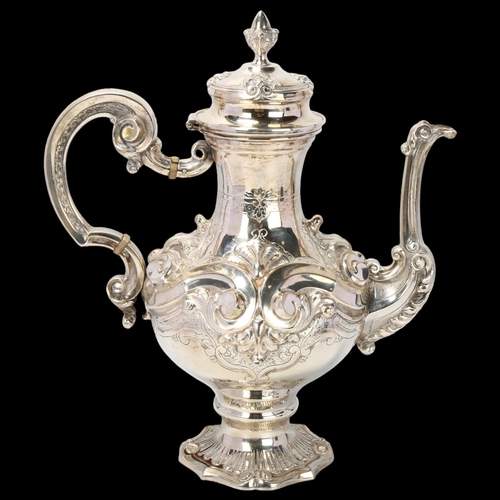 1789 - A Portuguese 833 standard silver coffee pot, pedestal baluster form, with high relief embossed and c... 