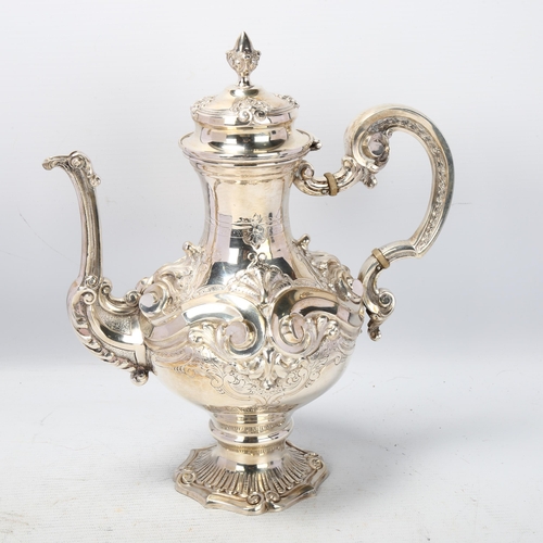 1789 - A Portuguese 833 standard silver coffee pot, pedestal baluster form, with high relief embossed and c... 