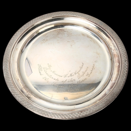 1797 - A German circular 800 silver salver, engine turned decoration, military inscription 