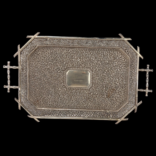 1799 - A Colonial Indian Kutch silver 2-handled tea tray, Karachi, early 20th century, elongated octagonal ... 