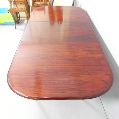 2029 - A mid-century Danish rosewood veneered draw-leaf extending dining table, 135 (extending to 185cm)x75... 