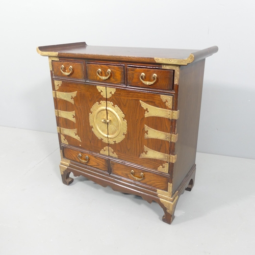 2032 - A Korean elm altar cabinet, with brass mounts, two cupboards and five drawers. 66x66x30cm.