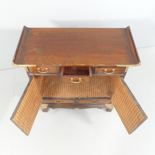 2032 - A Korean elm altar cabinet, with brass mounts, two cupboards and five drawers. 66x66x30cm.