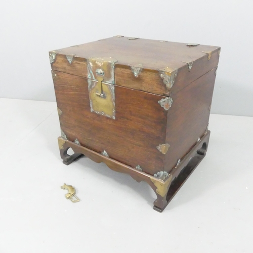 2034 - A Chinese elm box on stand, with brass mounts and lock. 48x46x40cm.